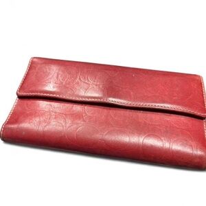 Vintage Coach embossed signature leather checkbook wallet in rich oxblood